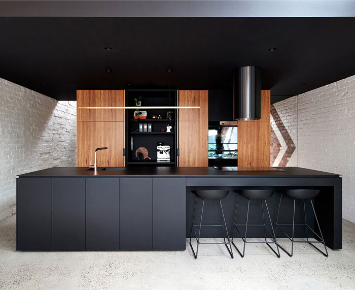 black kitchen cabinets with natural wood accents