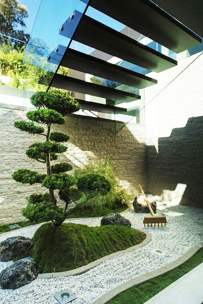 contemporary small zen garden under sairs