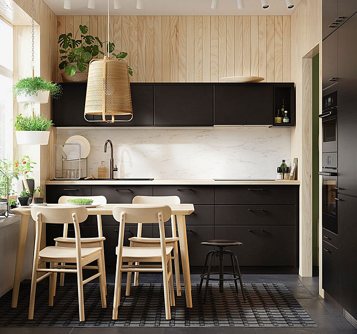 light filled space black kitchen and wood