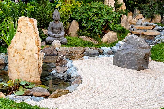 rock zen garden with buddha statue